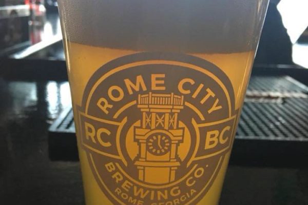 Rome City Brewing logo on a beer glass
